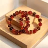 Women's Amber Tone Beaded Jewelry Set with Gold Tone Charms - Statement Necklace And Stackable Bracelets for Everyday Use